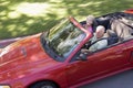 Couple in convertible car smiling Royalty Free Stock Photo