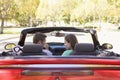 Couple in convertible car smiling Royalty Free Stock Photo