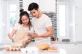 Couple cooking bakery in kitchen room, Young asian man and woman together Royalty Free Stock Photo