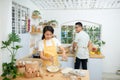 Couple cooking bakery in kitchen room, Young asian man and woman together making cake and bread with egg Royalty Free Stock Photo