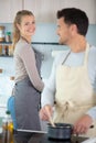 couple cooking at home in scene domestic bliss