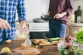 Couple cooking together healthy breakfast vegetables scrambled e