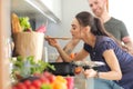 Couple cooking together in their kitchen at home