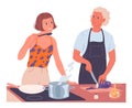 Couple cooking together. Woman cooks on the stove, man chops vegetables