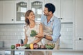 Couple, cooking and vegetable in kitchen together, healthy food and nutrition, happy with chef skill at home. Man, woman Royalty Free Stock Photo
