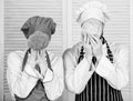 Couple cooks hold cabbage and broccoli in front of face. Healthy food concept. Couple cooking healthy vegetarian meal Royalty Free Stock Photo