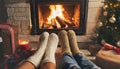 Couple put feet up next to a cozy warm open fire