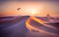 Couple cranes over high dune of calm desert in evening light, AI generated Royalty Free Stock Photo