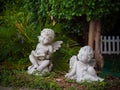 Couple cupid statue In the park. Royalty Free Stock Photo