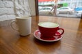 cups with coffee and matcha tea on a vintage wooden table in a coffee shop Royalty Free Stock Photo