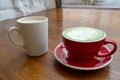 cups with coffee and matcha tea on a vintage wooden table in a coffee shop Royalty Free Stock Photo