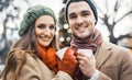 Couple with cups of mulled wine on Christmas market Royalty Free Stock Photo