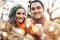 Couple with cups of mulled wine on Christmas market Royalty Free Stock Photo