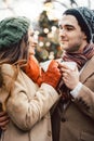 Couple with cups of mulled wine on Christmas market Royalty Free Stock Photo
