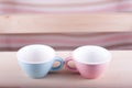 Couple cups of soft background symbol for men and women Royalty Free Stock Photo