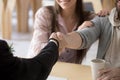 Couple customers handshaking businessman making successful deal, Royalty Free Stock Photo