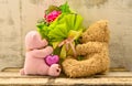 Couple of cute bear dolls holding roses bouquet Royalty Free Stock Photo