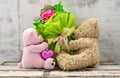 Couple of cute bear dolls holding roses bouquet Royalty Free Stock Photo