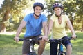 Couple On Cycle Ride In Countryside