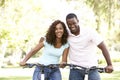 Couple On Cycle Ride in Park