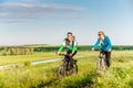 Couple cycling outdoors