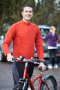 Couple Cycling Taking Mountain Bikes From Rack On Car Royalty Free Stock Photo