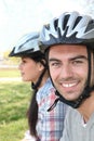 Couple of cyclists wearing helmets