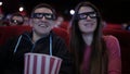Couple in 3D glasses waching a movie at cinema