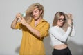 Couple with damaged hair. Haircare problem. Woman and man with hair loss problem. Studio portrait of young couple with a Royalty Free Stock Photo