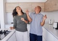 Couple, dance and freedom with a senior man and woman dancing together in the kitchen of their home. Happy, smile and Royalty Free Stock Photo