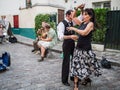 Couple dances to street musicians' jazz on Montmartre in Paris