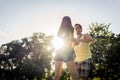 Couple dancing bachata in park backlit training dip figure Royalty Free Stock Photo