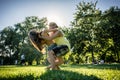 Couple dancing bachata in park backlit training dip figure Royalty Free Stock Photo