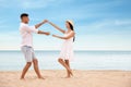 Lovely couple dancing on beach near sea Royalty Free Stock Photo