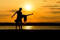 A couple dancing by the sea at sunset Royalty Free Stock Photo