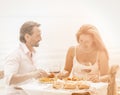 Couple dating dinner. Happy lovers on table in restaurant Royalty Free Stock Photo