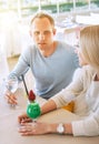 Couple dating moment in cozy sunny restaurant Royalty Free Stock Photo