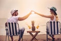 Couple on a deck chair relaxing on the beach. Royalty Free Stock Photo