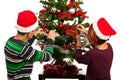 Couple decorate Christmas tree