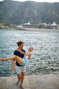 Couple on dock. Man holding woman in his arms. Beautiful sea view enjoying freedom. Travel, love, fun, togetherness, lifestyle Royalty Free Stock Photo