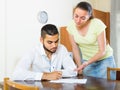 Couple with documents in apartment Royalty Free Stock Photo
