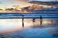 Couple with dog, Bali sunset