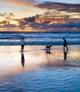 Couple with dog, Bali sunset