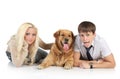 Couple with a dog lying on a white background Royalty Free Stock Photo