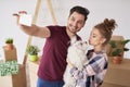 Couple with dog making a selfie in new home Royalty Free Stock Photo