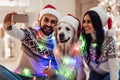 Couple with dog on New Year`s Eve Royalty Free Stock Photo