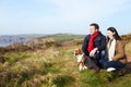 Couple With Dog Walking Along Coastal Path Royalty Free Stock Photo