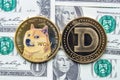 A couple of Dogecoin with one dollar bills on the background