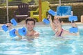 couple doing aquagym in resort