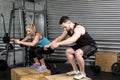 Couple doing box jumps in gym Royalty Free Stock Photo